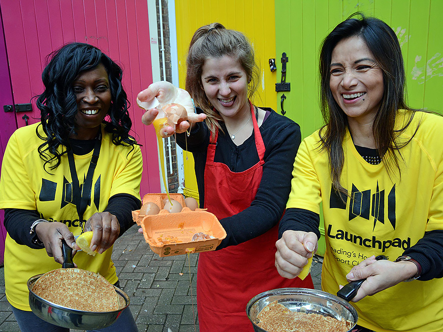 young women preparing for pancake race