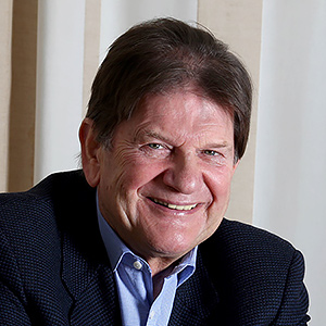 man smiling and looking into camera