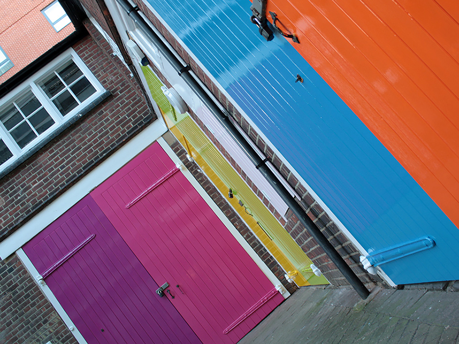 The colourful stable doors at Launchpad's office in Reading town centre, there is a purple, pink, yellow, light green, mid blue and orange door.