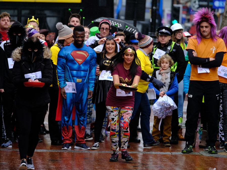 audience looking at pancake race