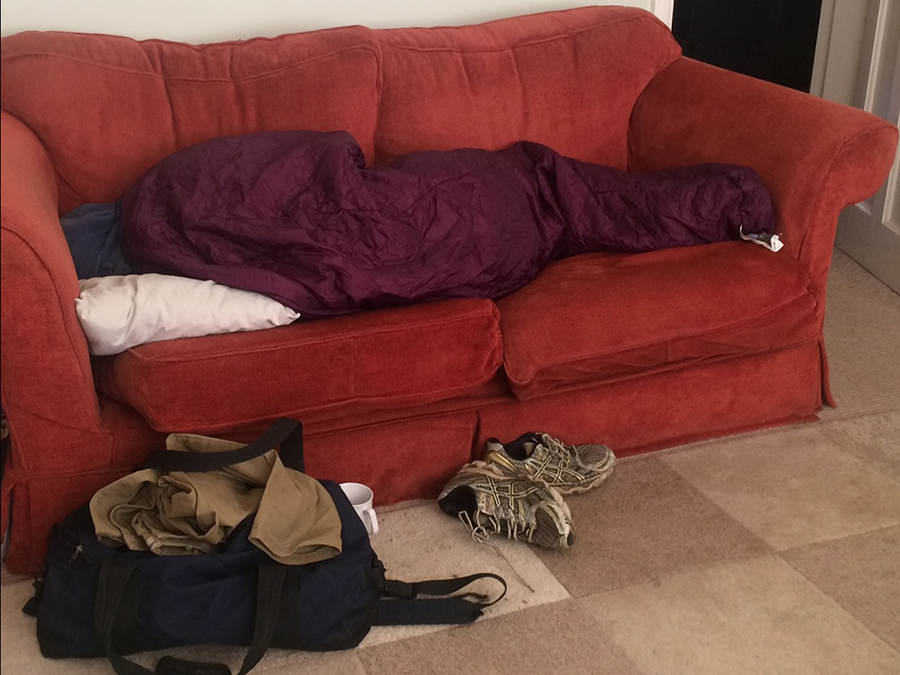 homeless man sleeping on sofa
