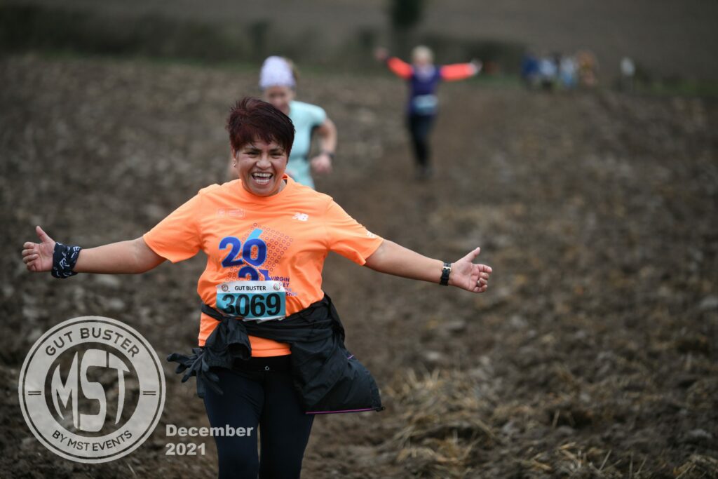 Woman taking part in Gut Buster run
