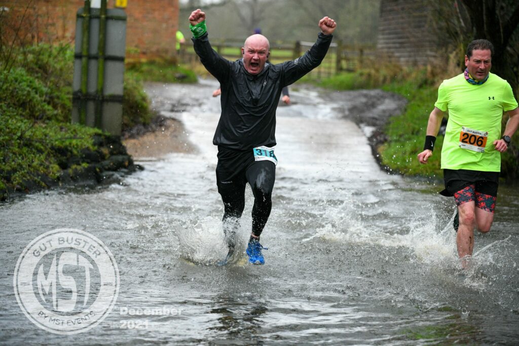 Man taking part in Gut Buster run