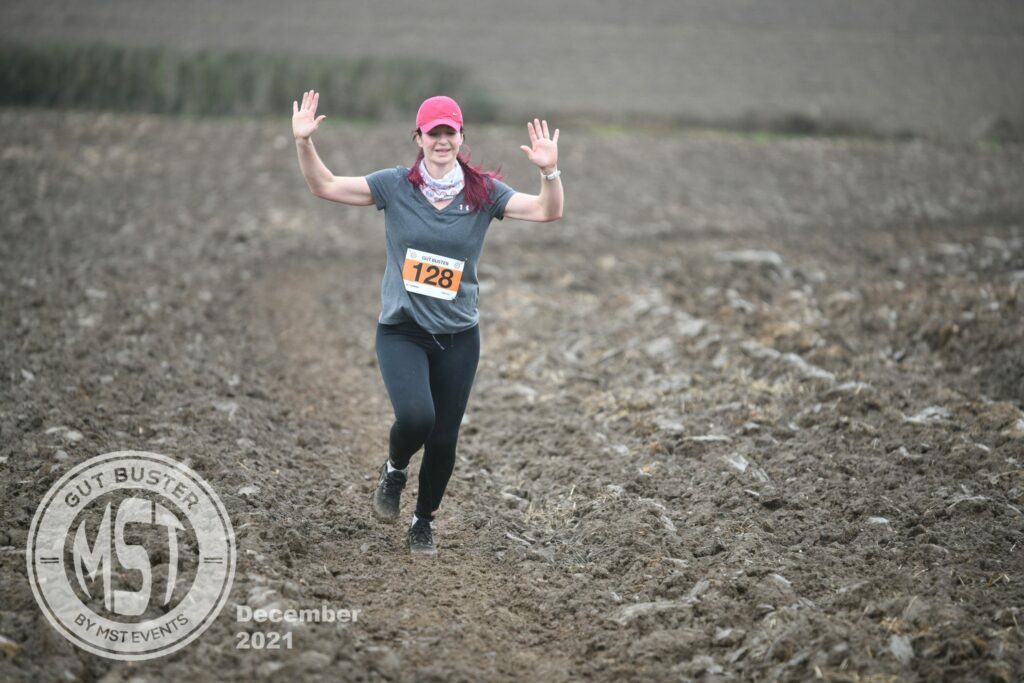 Woman taking part in Gut Buster run