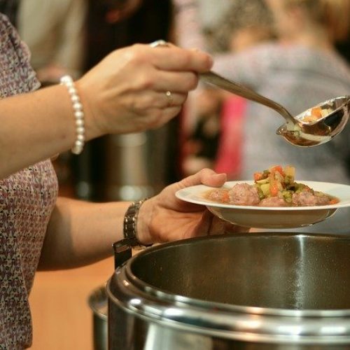 Person ladling soup